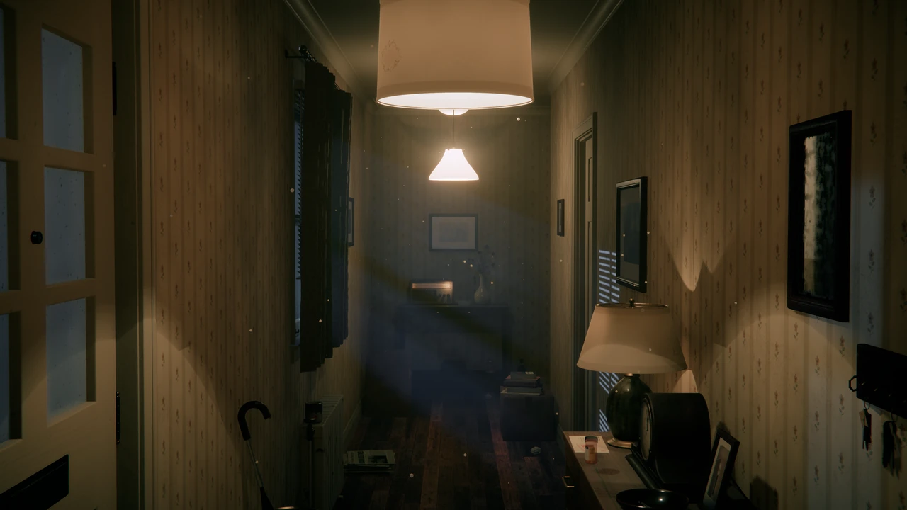 A narrow 1980s hallway lit by two pendant lamps, floral wallpaper, a dresser with a table lamp and a mantel clock, a valve radio at the far end.