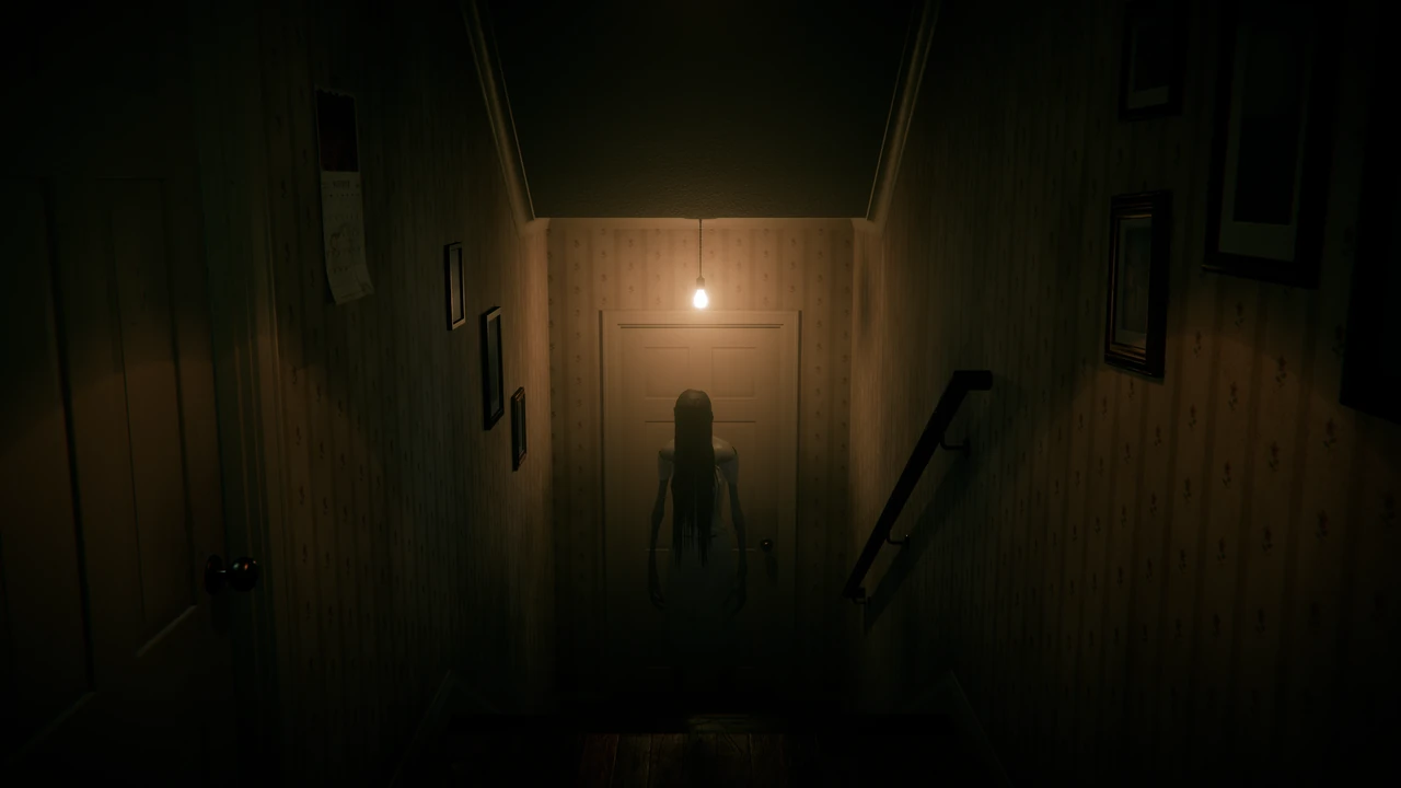 At the bottom of a staircase, under a bare light bulb, a thin woman in a white nightgown stands in front of a closed door, her long wet hair hiding her face.